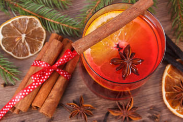 Mulled wine for christmas or winter evening with spices and spruce branches