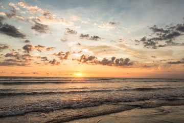 Naklejka na ściany i meble Sunset over Kuta beach in Bali, Indonesia