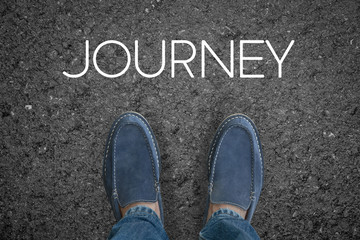 Man feet on asphalt road with start journey concept.