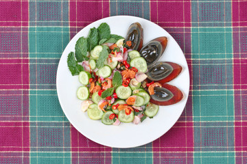 Spicy cucumber salad with dried shrimp and  preserved egg.