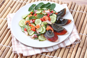 Close up spicy cucumber salad with dried-shrimp and  preserved e