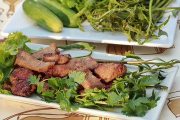 Closeup,Grilled pork with mixed herb served .