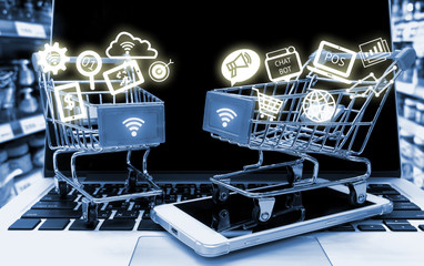 Data Management Platform marketing crm and smart retail concept. Infographic with two shopping carts on smart phone laptop in retail shop background