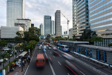 Fototapeten Jakarta rush hour along the main avenue in the business district in Indonesia capital city © jakartatravel