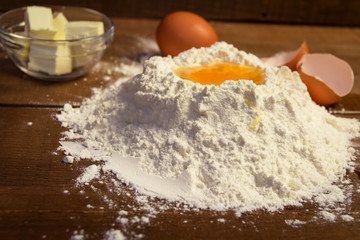 Obraz na płótnie Canvas Baking background with flour,egg and butter