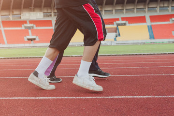 Two runners sprinting outdoors Sportive people training in a urb