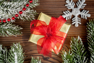 packaging christmas gifts in boxes on wooden background top view