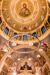 Interior of an orthodox church decorated with hagiographies
