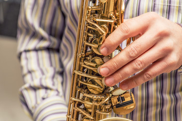 Hands of saxophone player
