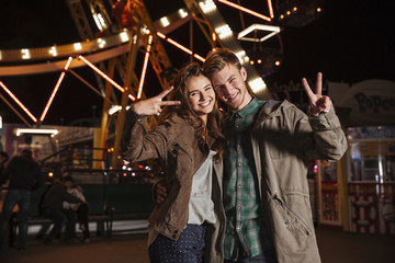 Young couple in amusement park