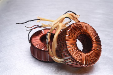 Copper Coils Transformer on Metal Background