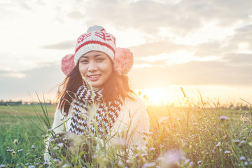 Young beautiful woman wearing winter clothing while standing enj