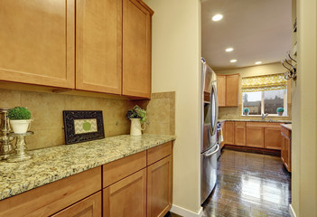 Cloose up of wooden cabinets with granite counter top