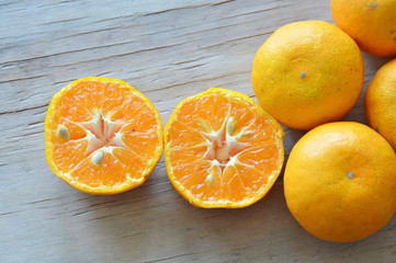 orange cut on wooden board