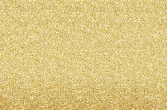 Gold and yellow Christmas Glittering background. Holiday abstrac