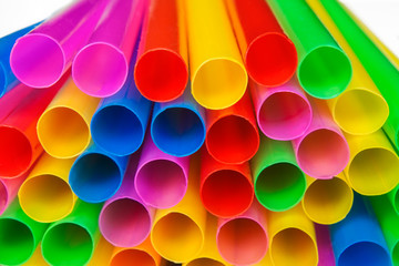 Pile of colorful plastic straws - macro image.