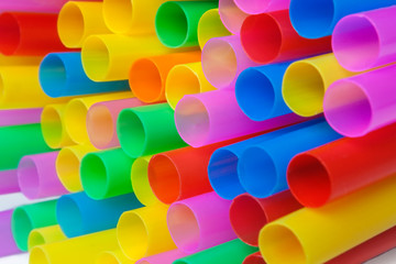 Pile of colorful plastic straws - macro image.
