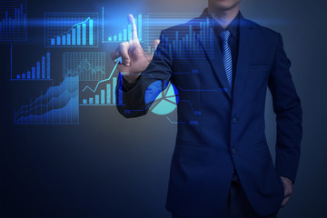 Close up of businessman touching finance graph with finger
