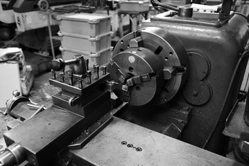 Obsolete lathe. Black-and-white photo.