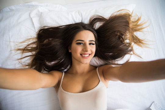 Beautiful Girl Making Selfie In The Bed