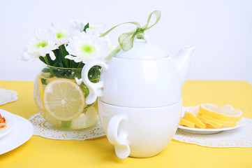 Yellow summer table setting with lemon bundt cake