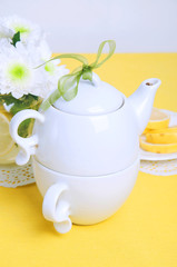 Yellow summer table setting with lemon bundt cake