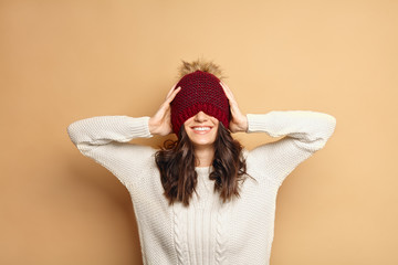 happy young Caucasian brunette woman in winter outfit