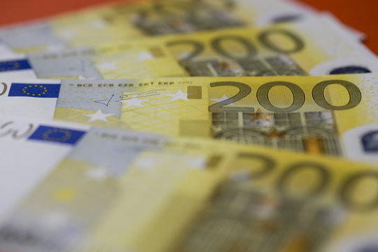 200 euro banknotes row close up shot. Selective focus.