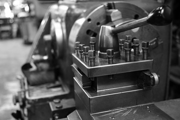 Obsolete lathe. Black-and-white photo.