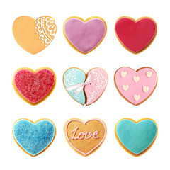 Set of delicious heart shaped cookies on white background