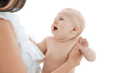 Mother holding little baby on light background