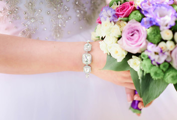 beautiful wedding bouquet of pink flowers in bride's hands