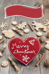 Christmas heart shaped gingerbread background. Winter holidays atmosphere. Snoflakes. Hand drawn ribbon for copy.Perfect for greeting cards, flyers, etc.