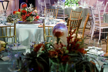 White light illuminates composition of exotic flowers on dinner