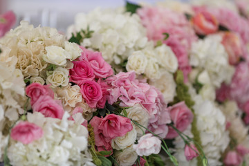 White and pink roses put in a garland