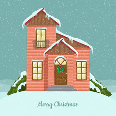 House illustration with Christmas wreath on door and icing on rooftop, in snowfall. For greeting card.