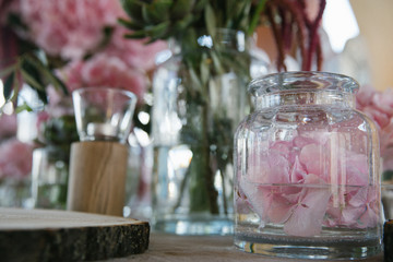 Pink peony in bottle with water