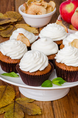 Carrot cupcakes with walnuts and butter cream on top