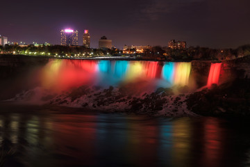 Fototapeta na wymiar Illumination of Niagara Falls by Night 