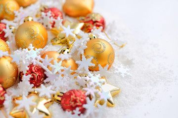 Composition of the Christmas decorations on snow with space for text