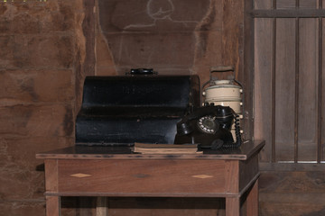 Old typewriter on a wooden desk
