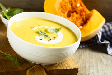 Pumpkin soup with basil and cream