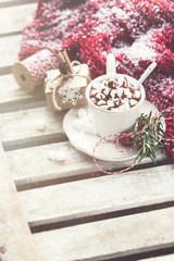 Homemade tasty hot chocolate in a cup with christmas decorations