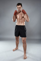 Obraz premium Kickbox fighter in guard stance