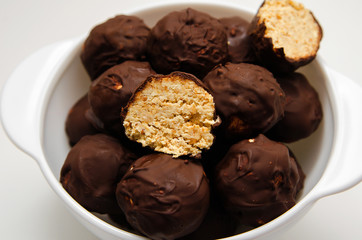 Homemade candy of peanuts, honey and chocolate. Proper nutrition