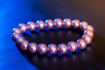 Pearl necklace isolated on dark background