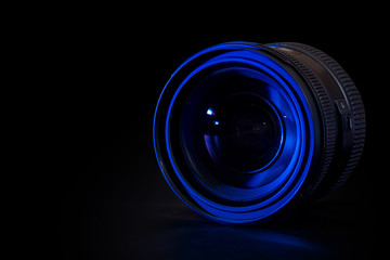 Front view of photo lens isolated on black background