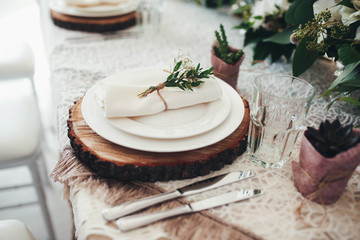 beautiful table setting with wooden disks for wedding guests