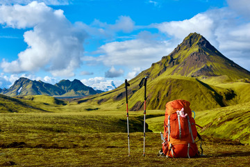 backpack and Trekking Poles on the trail in the Islandic mountains. Trek in National Park...