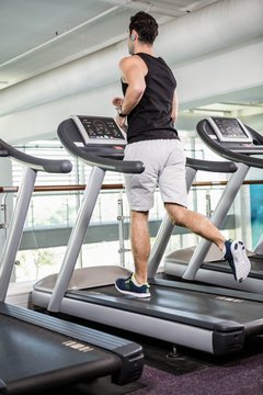 Fit Man Running On Treadmill